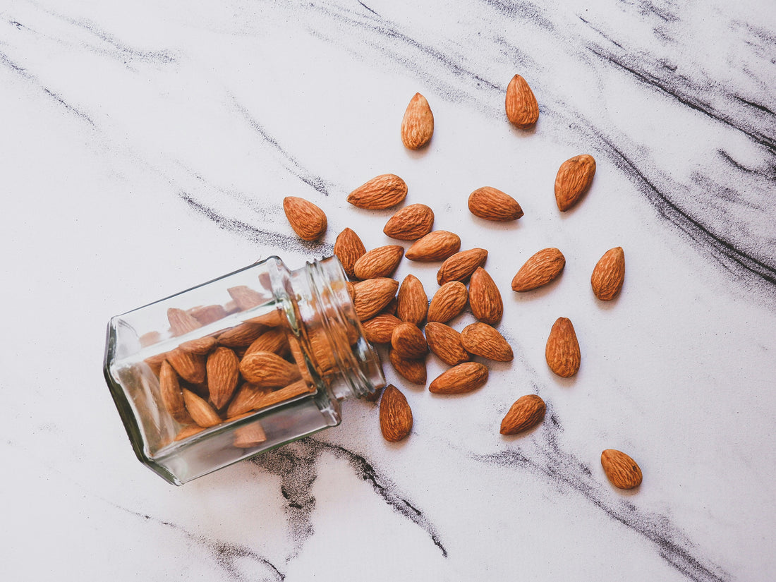 Scattered almonds on a white table