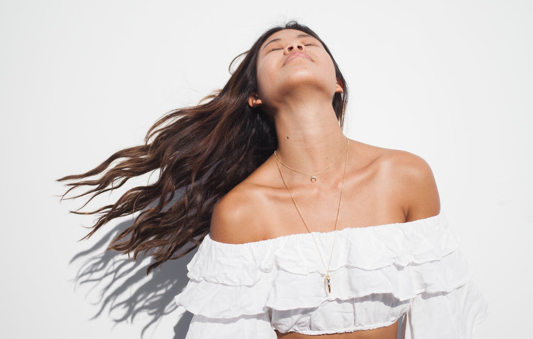 A girl with her hair flowing in the wind