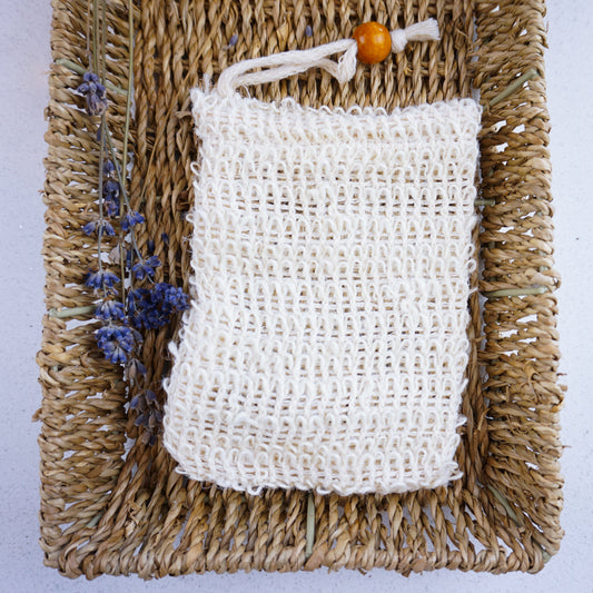Natural Exfoliating Bag in hamper tray with dried lavender