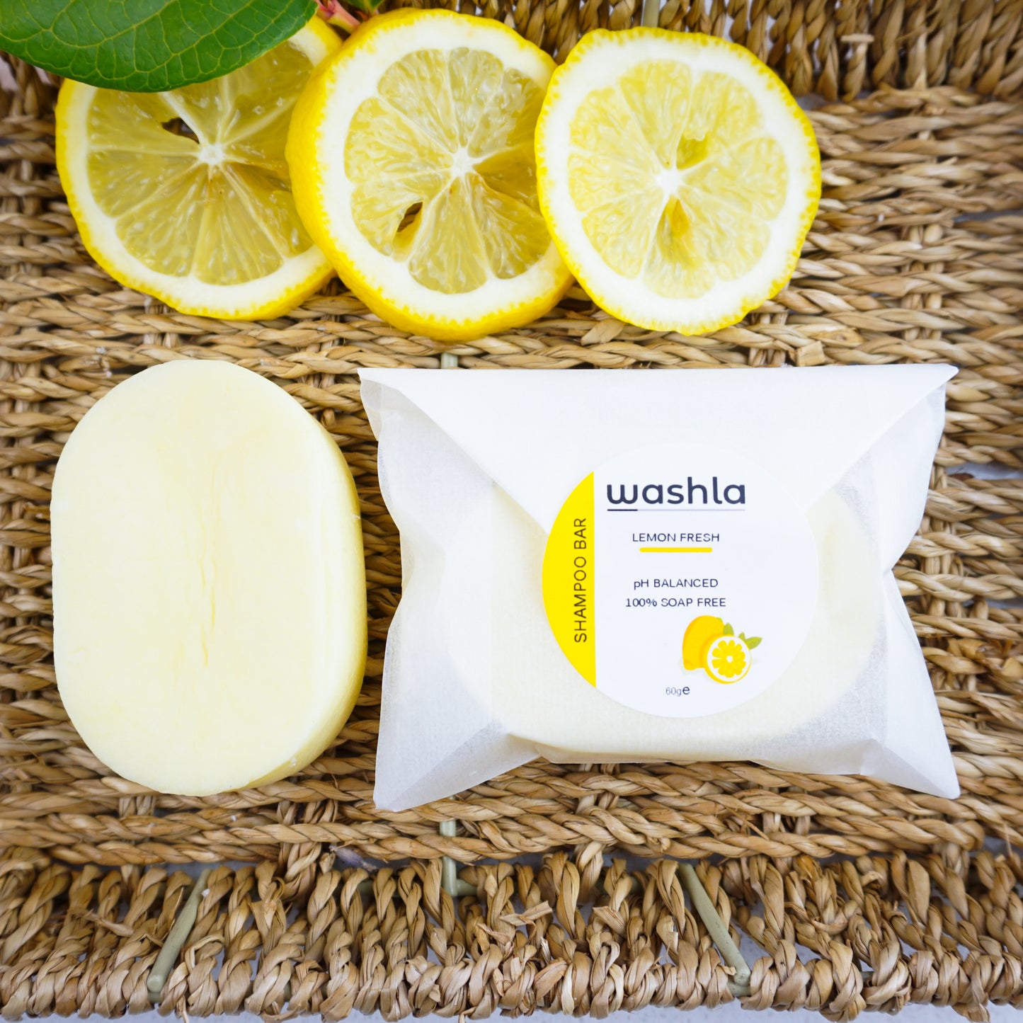 Washla Lemon 60g Shampoo bar wrapped on hamper basket