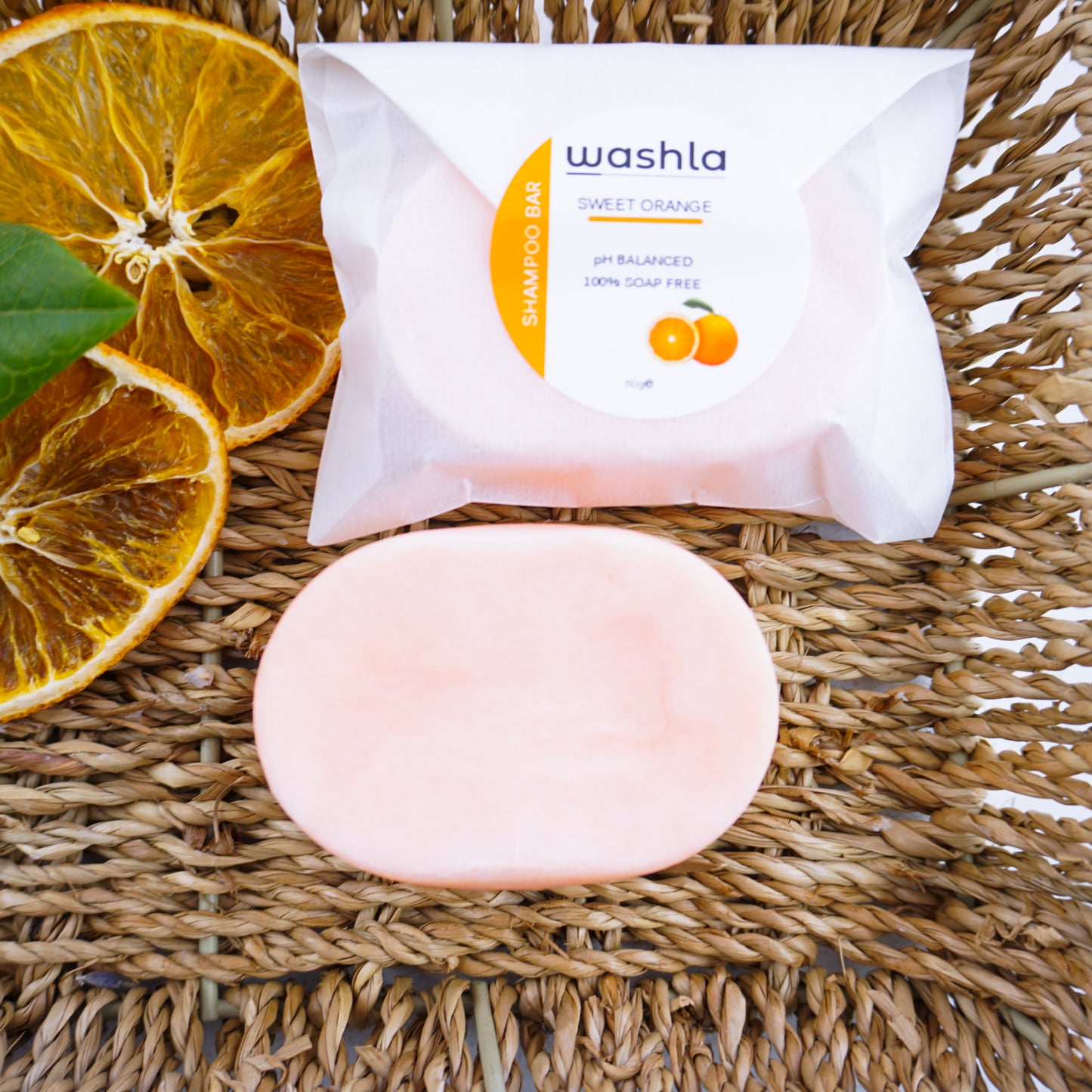 Washla 60g Orange shampoo bar. One wrapped and one unwrapped.