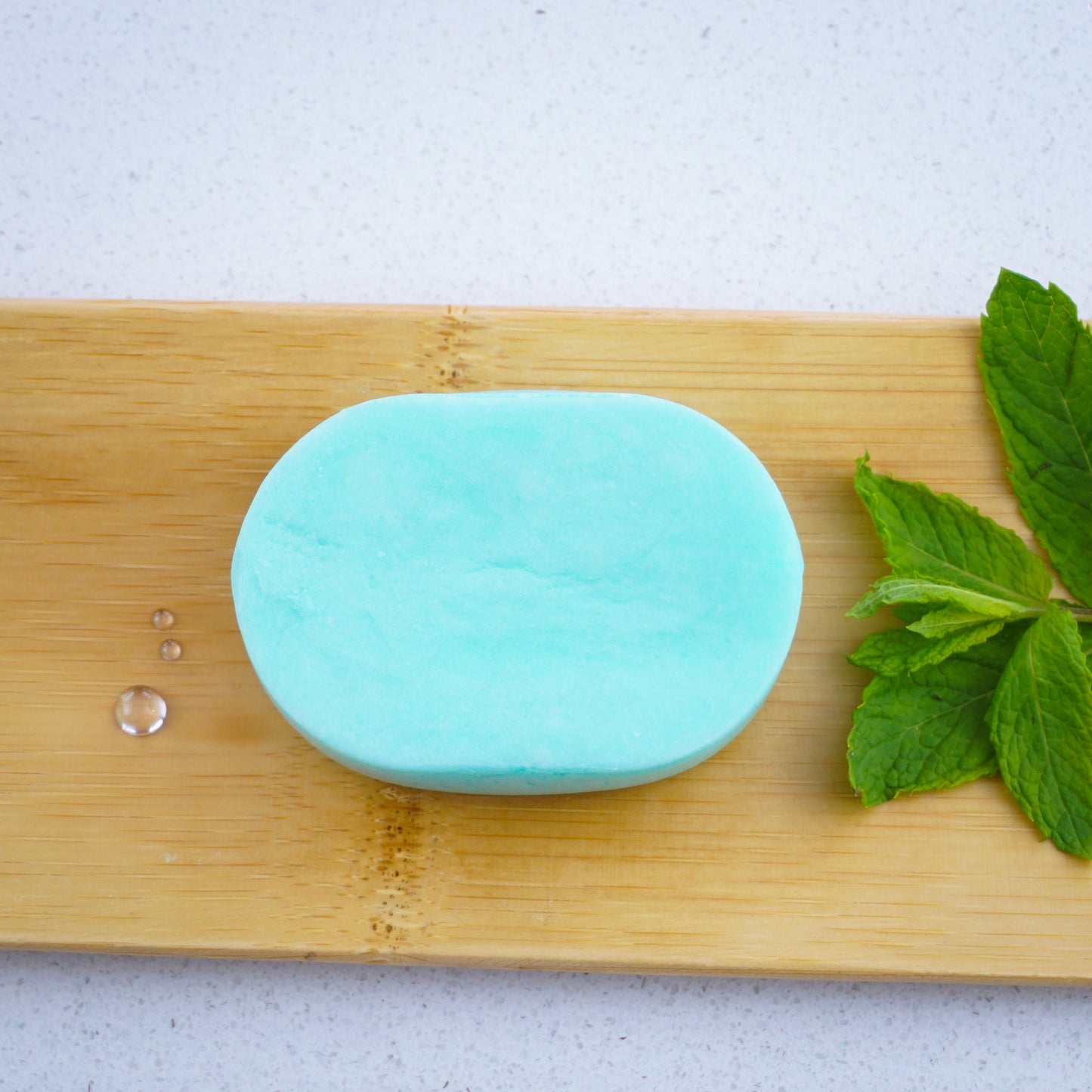 Washla 60g Cool Peppermint Shampoo bar on bamboo tray