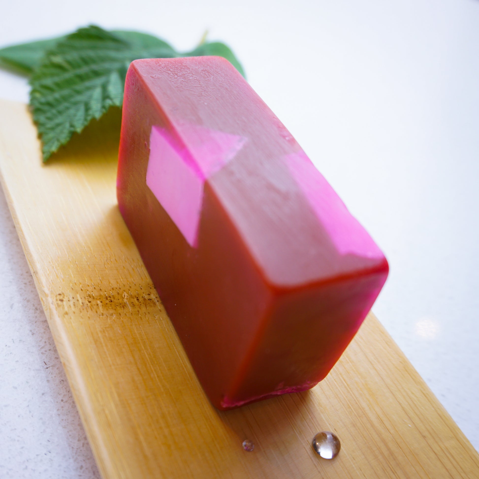 Black Raspberry & Vanilla Soap Bar On Bamboo Tray with droplets