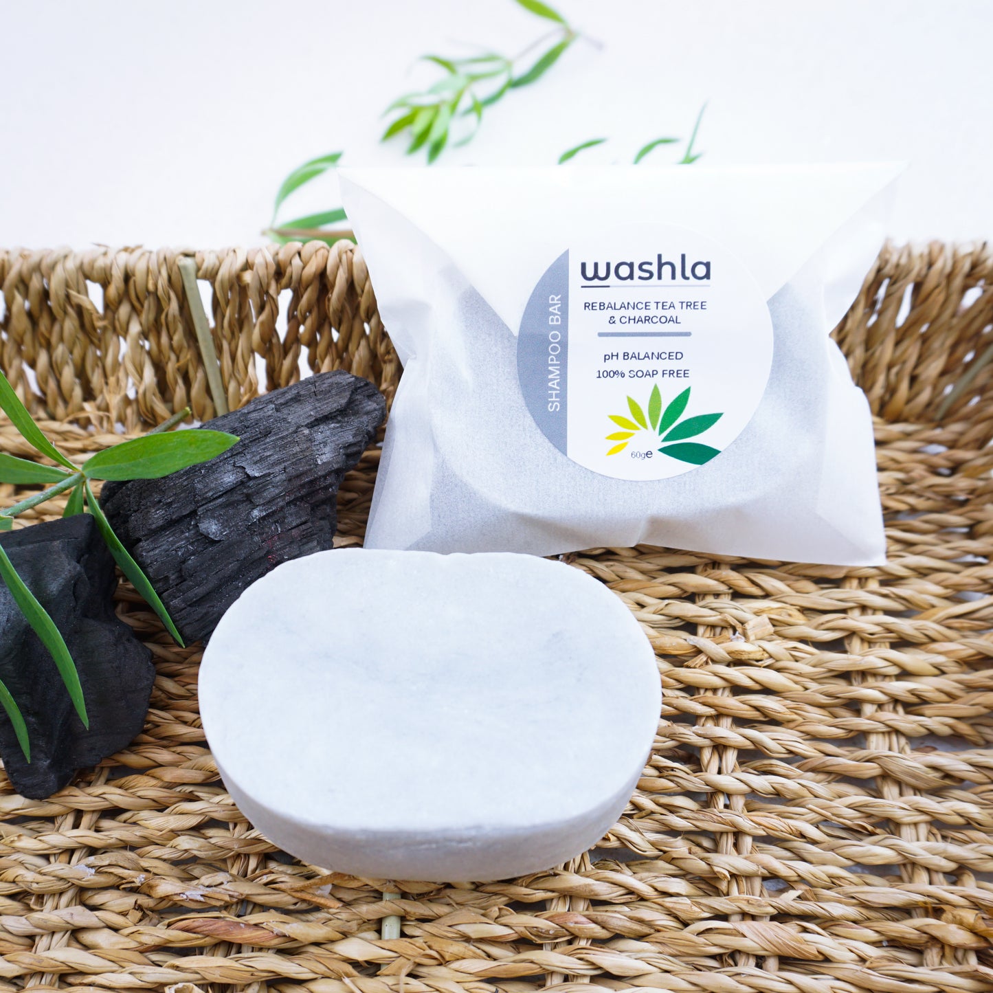 Washla Tea Tree and charcoal 60g Shampoo bar on hamper tray