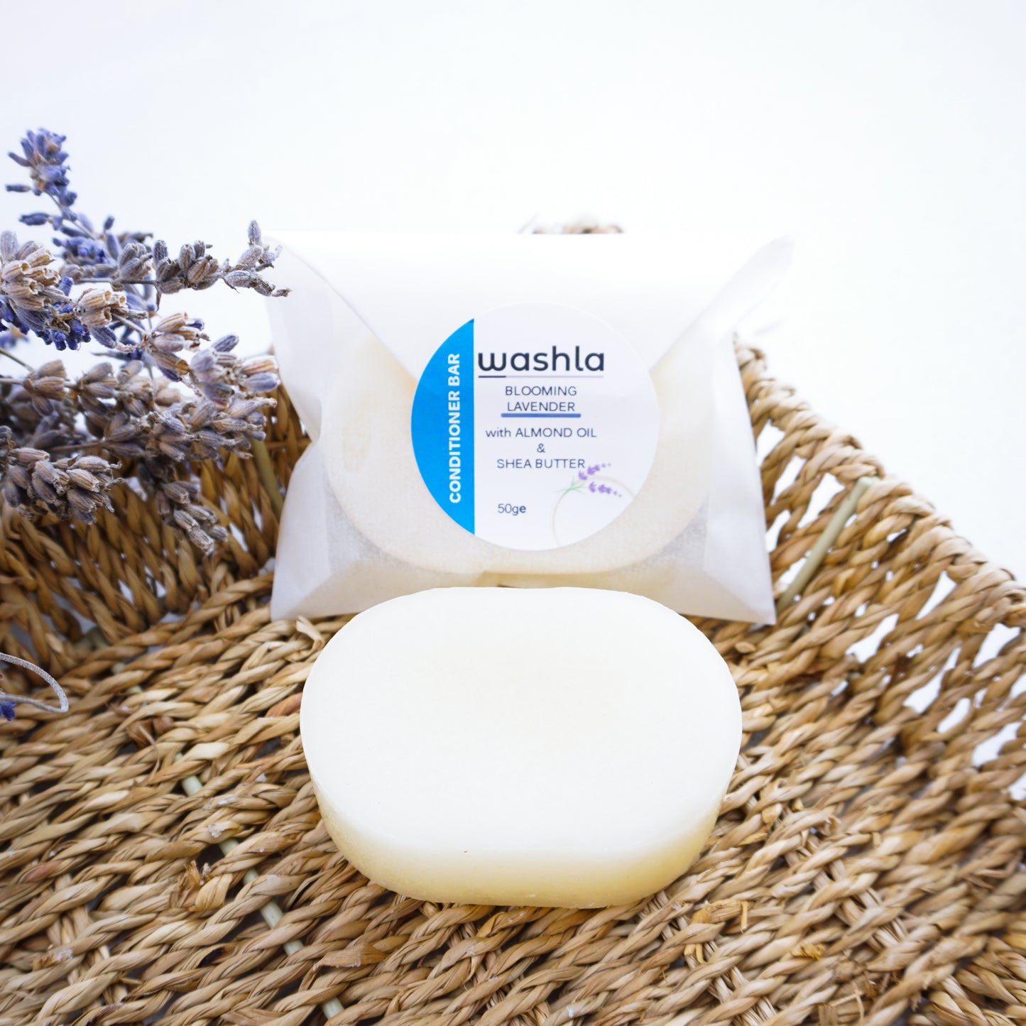 lavender conditioner bar on hamper basket with lavender dried leaves