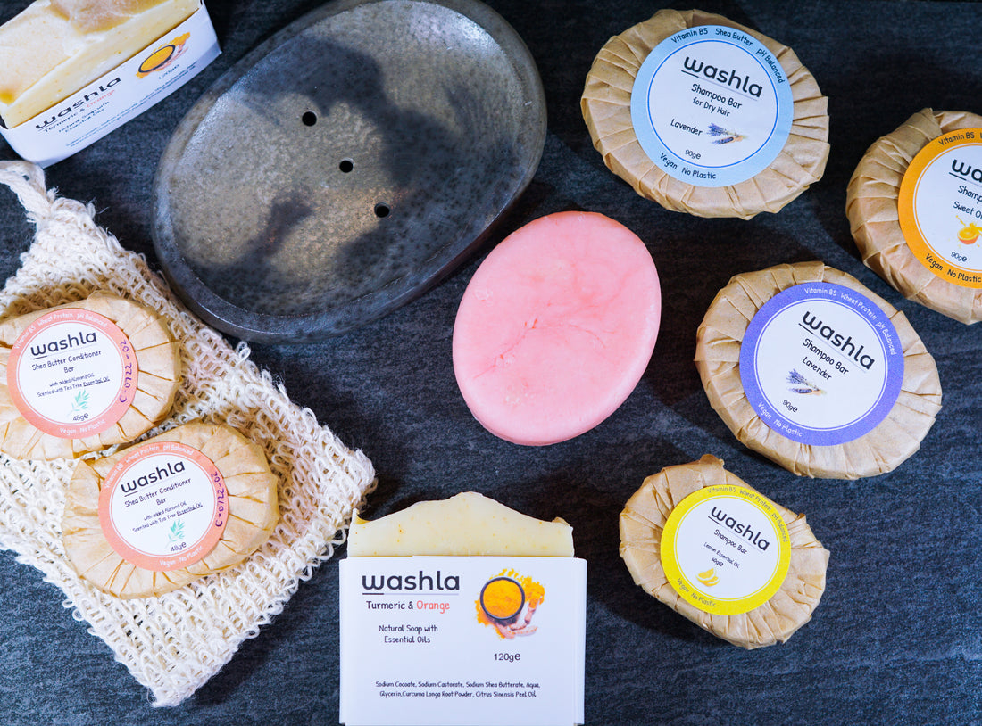 Collection of Washla products, includes shampoo bars, conditioner bars and turmeric soap bars