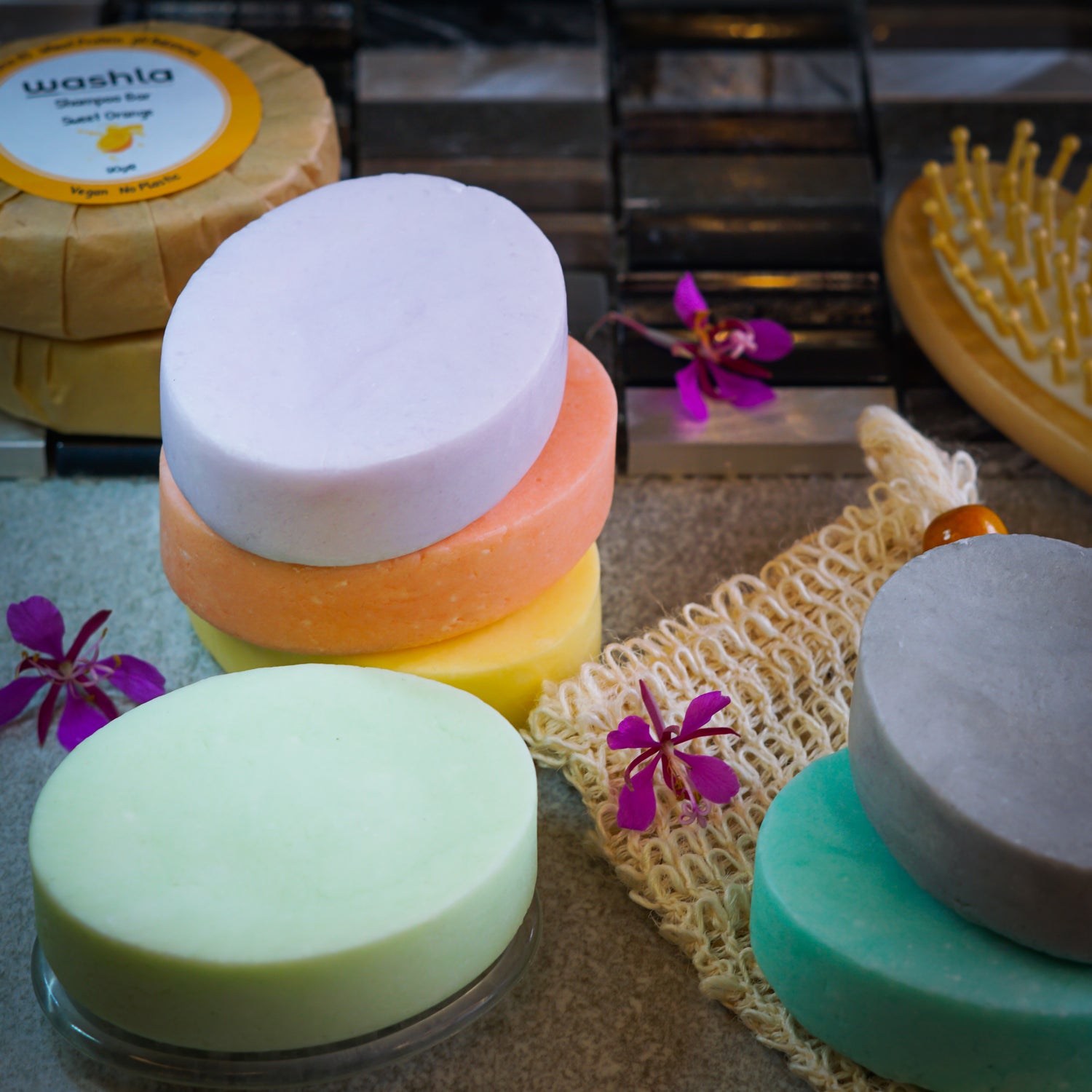 A collection of 90g shampoo bars in different colours and scents