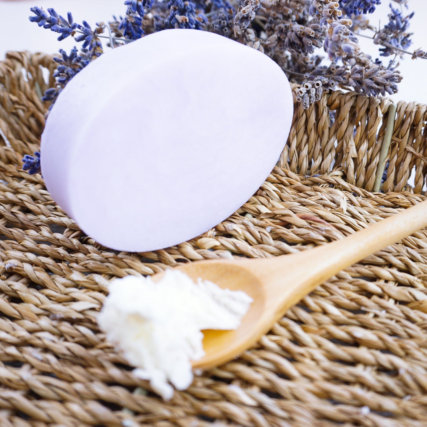 Washla lavender hydrating shampoo bar on a basket with dried lavender for decoration