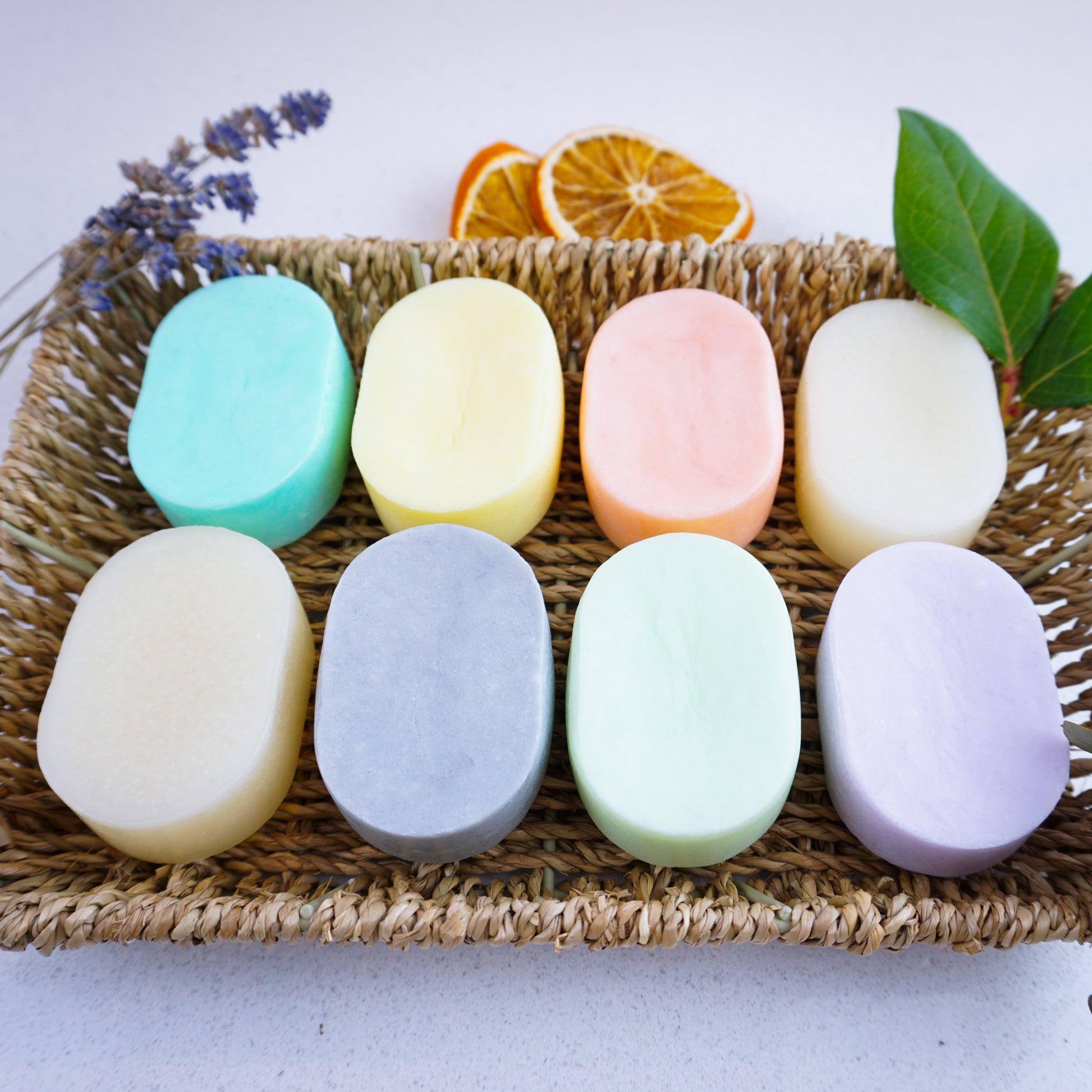 Unwrapped shampoo and conditioner bars by Washla