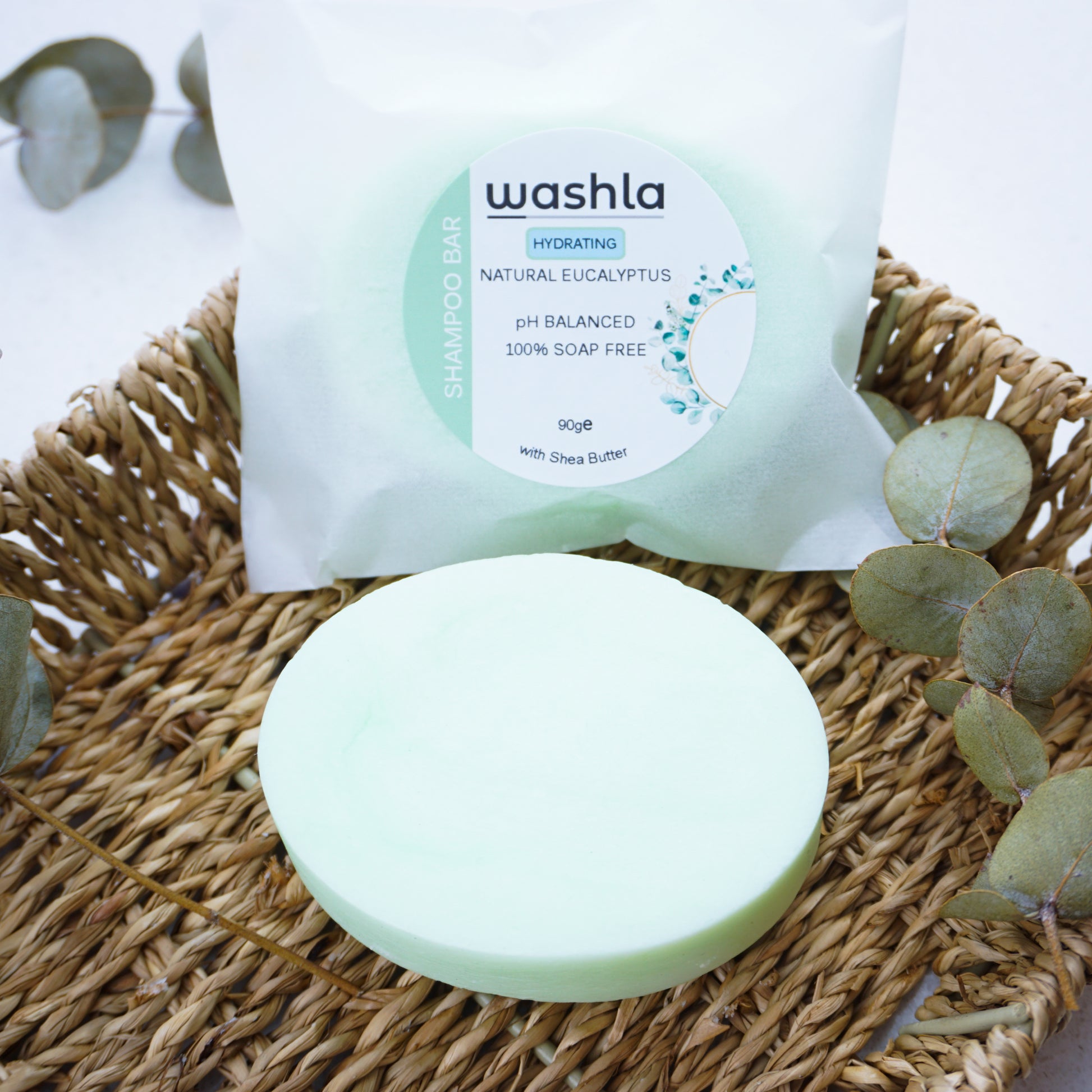 Washla Eucalyptus Hydration shampoo bar sitting on hamper basket