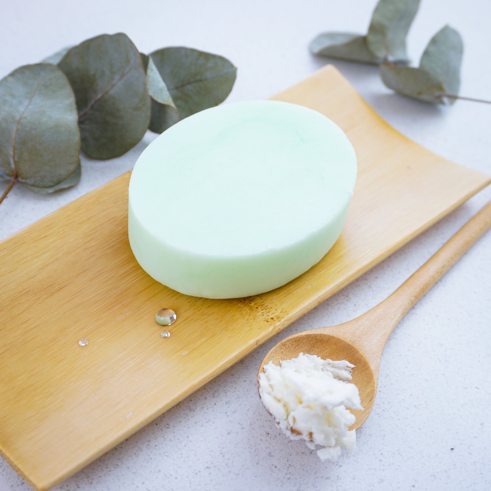 Washla Hydrating Eucalyptus Shampoo Bar with a spoonful of shea butter