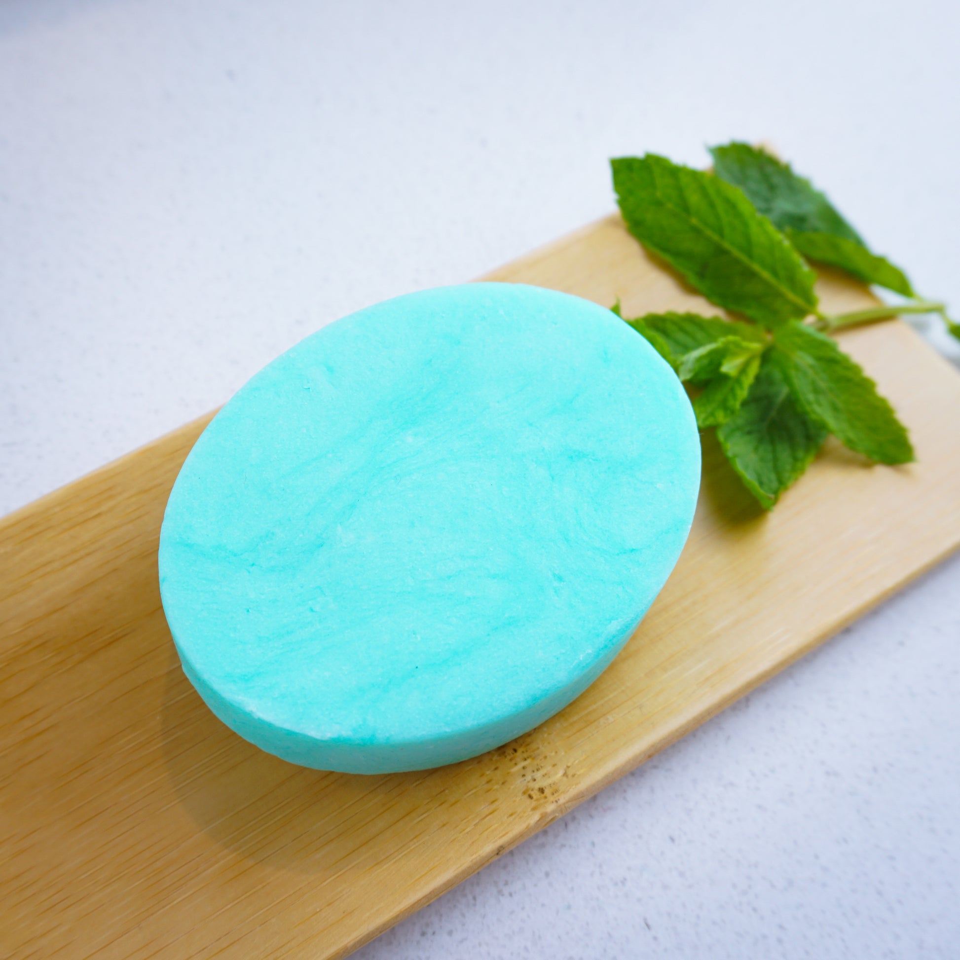 peppermint hydrating shampoo bar with mint leaves