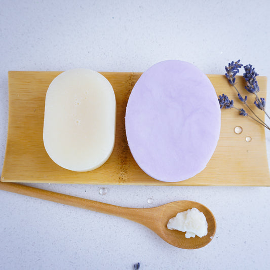 Lavender shampoo bar paired with lavender conditioner bar. Placed on bamboo tray.