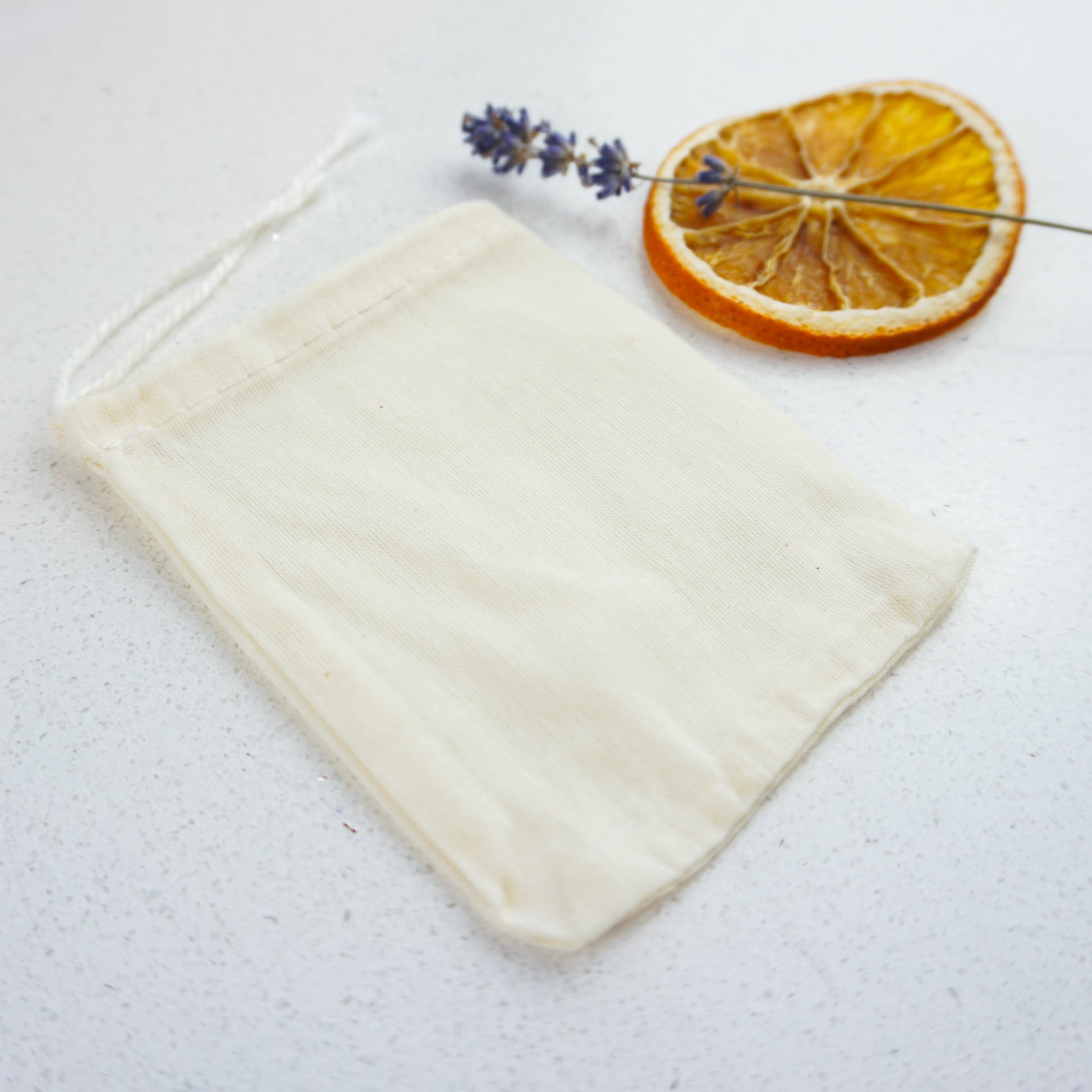 Cotton Muslin Drawstring Bag with a slice of dried lemon and lavender for decoration