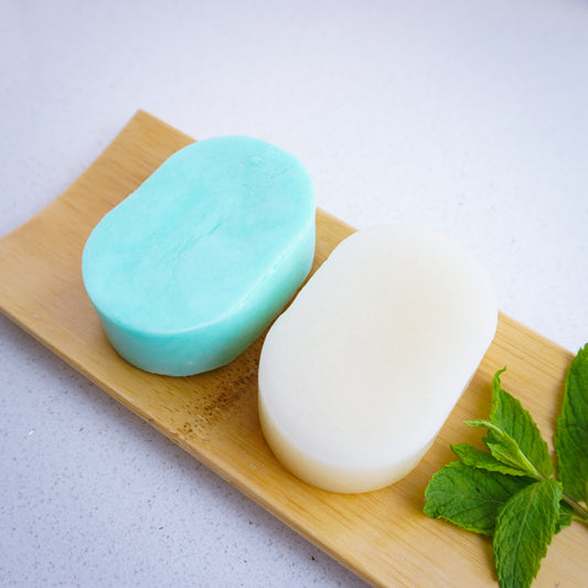 peppermint conditioner bar with peppermint shampoo bar on bamboo tray