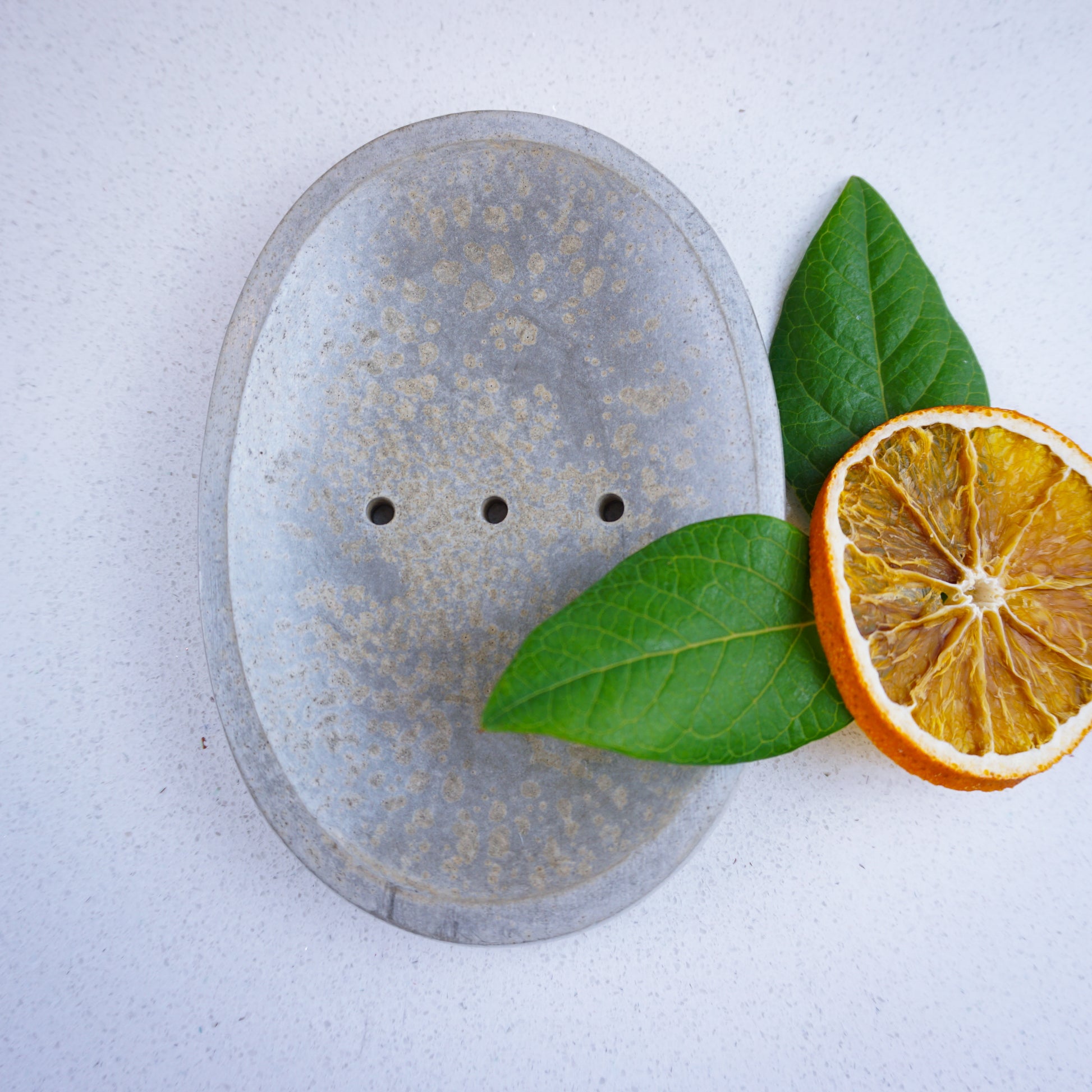 Concrete soap dish with 3 drainage holes. Orange and leaves for decoration