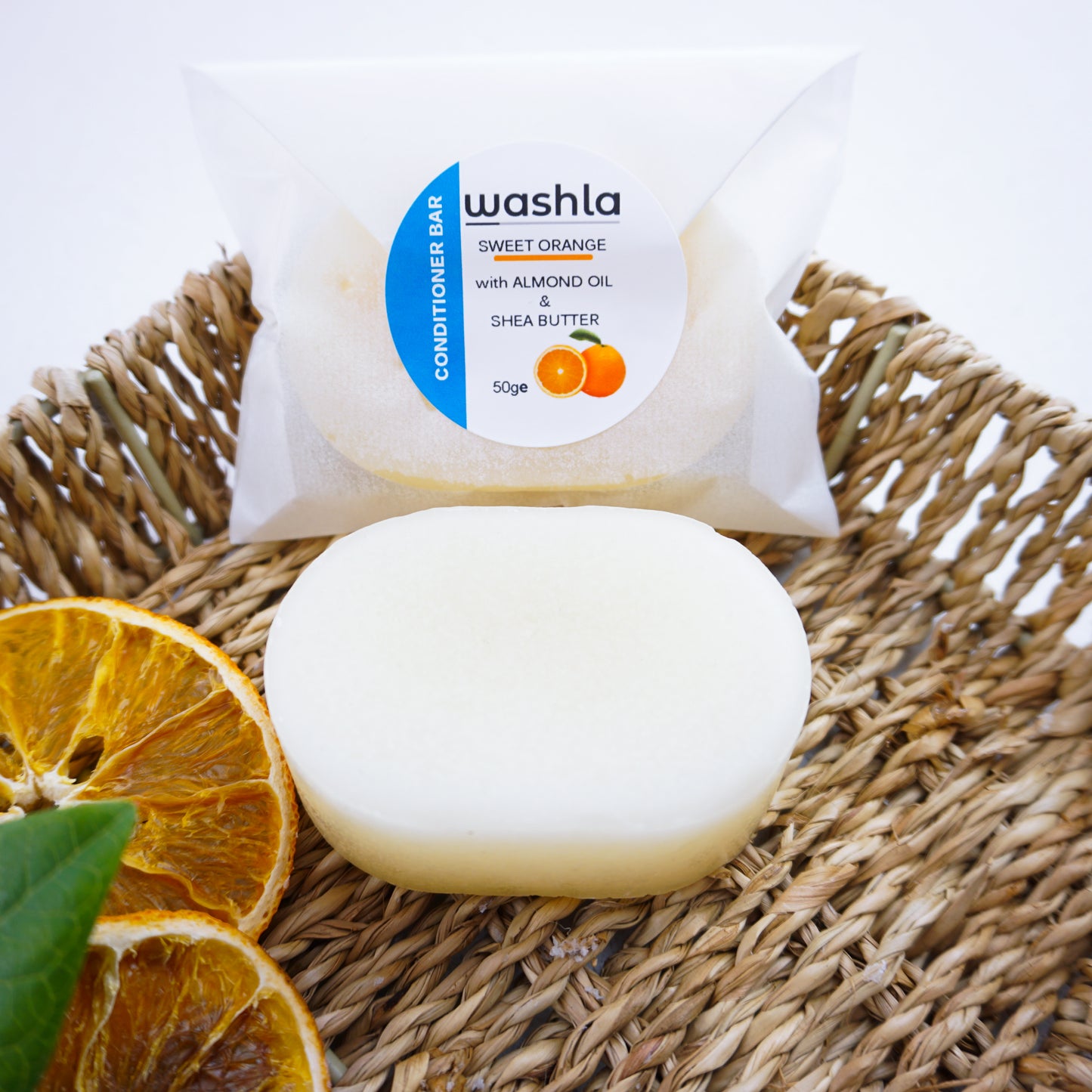 washla orange conditioner bar wrapped on hamper