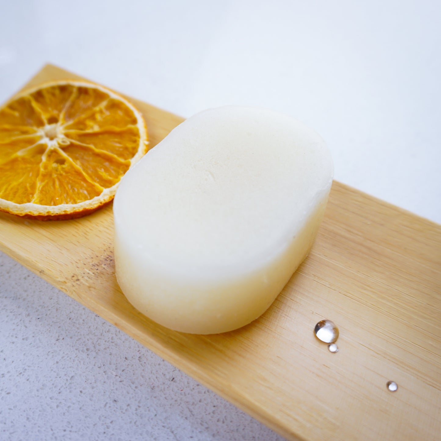 orange conditioner bar with a slice of dried orange